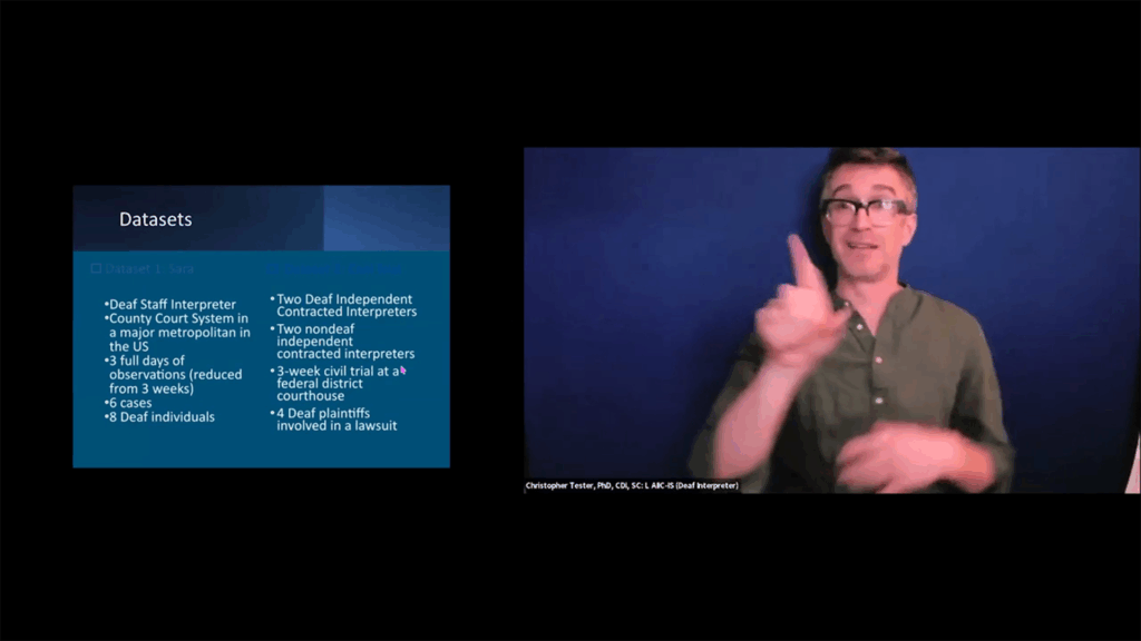 The slide lists data sets, including observations of a "Deaf Staff Interpreter" and "two Deaf independent contracted interpreters" in a major US county court system. On the right, a man in glasses and a dark blue shirt is signing, holding up his right hand with his index finger extended.