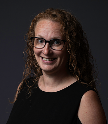 Aaryn Adams' professional headshot.